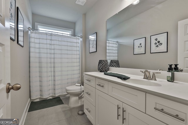 bathroom with vanity and toilet