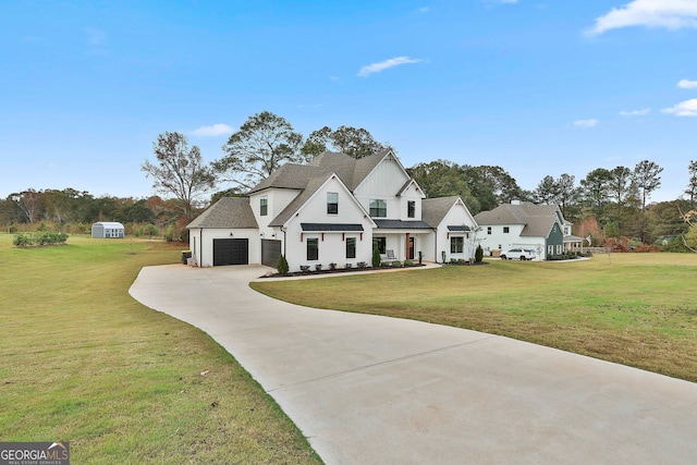 view of front of house featuring a front yard and a garage