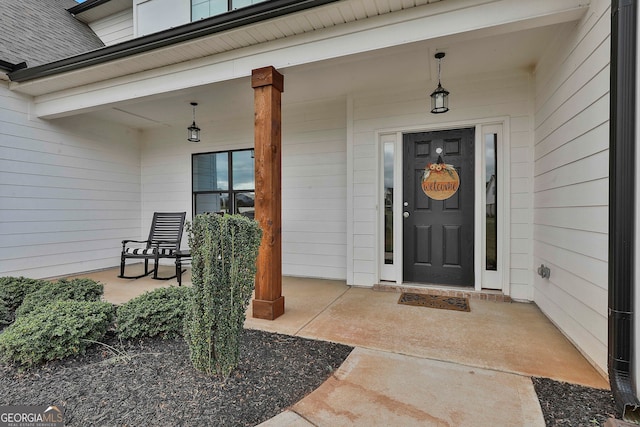 property entrance featuring a porch