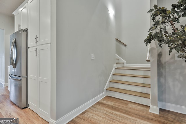 stairs with wood-type flooring