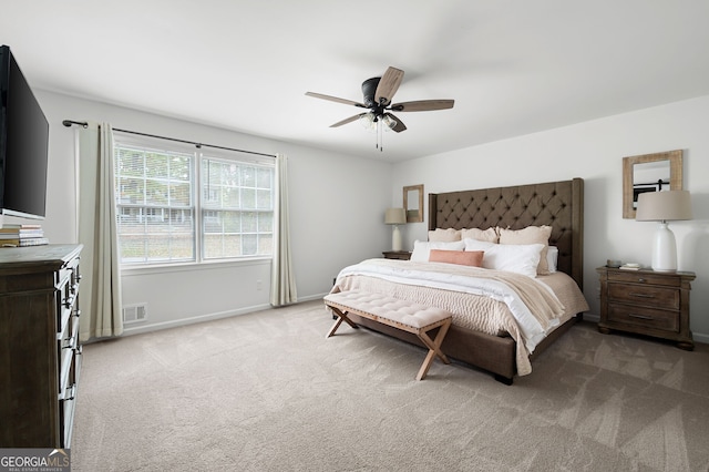 carpeted bedroom featuring ceiling fan