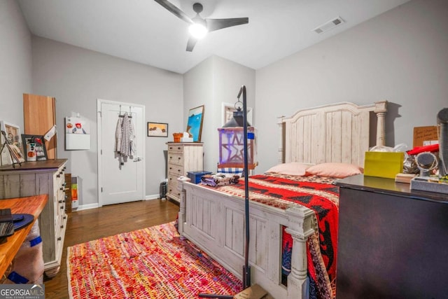 bedroom featuring ceiling fan and dark hardwood / wood-style flooring