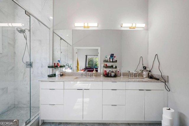 bathroom featuring vanity and a shower with shower door