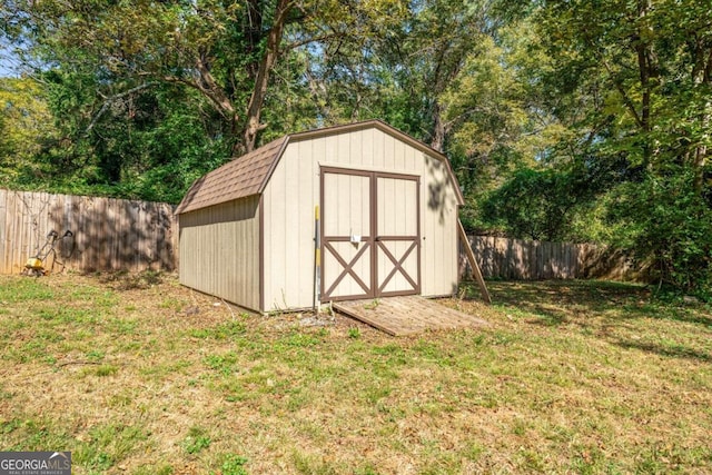 view of outbuilding featuring a lawn