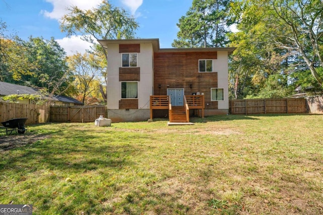 back of property featuring a lawn