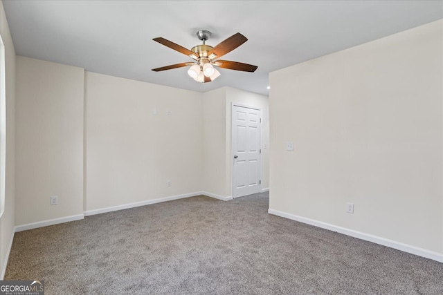 spare room featuring carpet flooring and ceiling fan