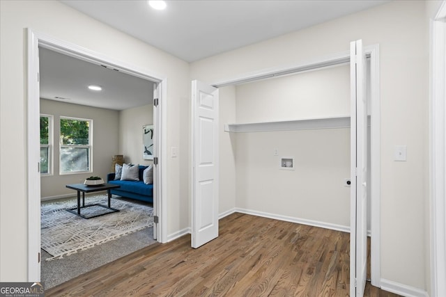 laundry room with washer hookup and dark hardwood / wood-style floors