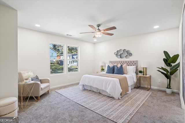 bedroom with light colored carpet and ceiling fan