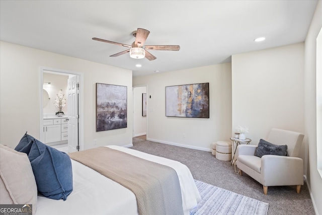 carpeted bedroom featuring ensuite bathroom and ceiling fan