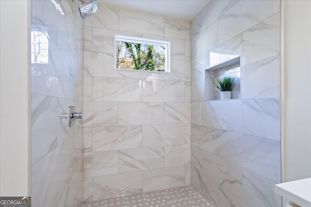 bathroom with a tile shower