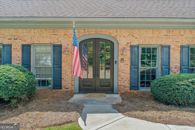 view of exterior entry featuring french doors