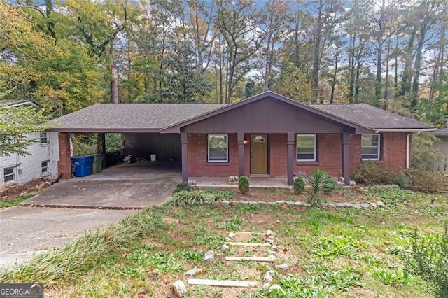 ranch-style house with a carport and a porch