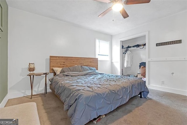 carpeted bedroom with ceiling fan and a closet