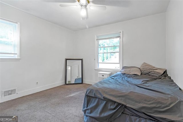 carpeted bedroom featuring ceiling fan