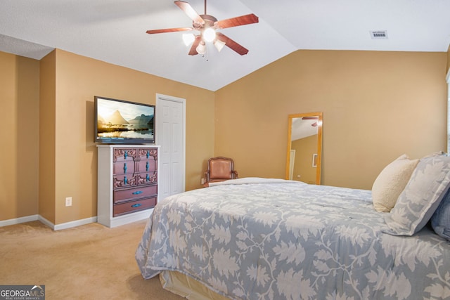 bedroom featuring light colored carpet, ceiling fan, and vaulted ceiling