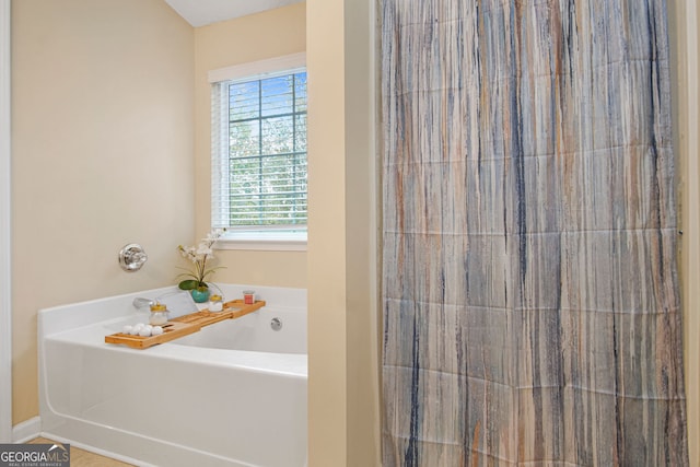 bathroom featuring a tub