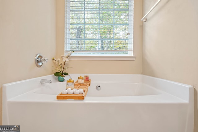 bathroom with a tub