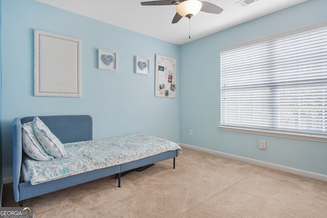 bedroom with light colored carpet and ceiling fan