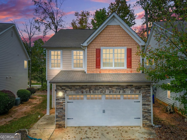 view of front of property featuring a garage