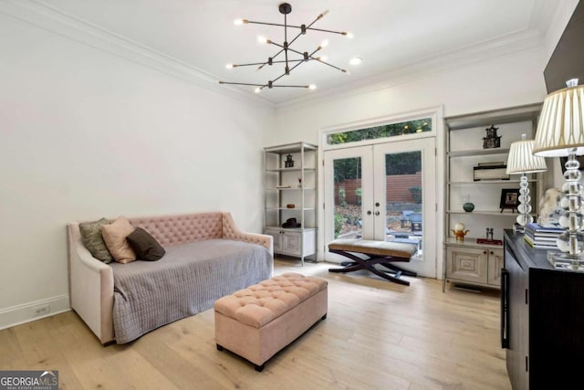 interior space with french doors, light hardwood / wood-style floors, a chandelier, and crown molding