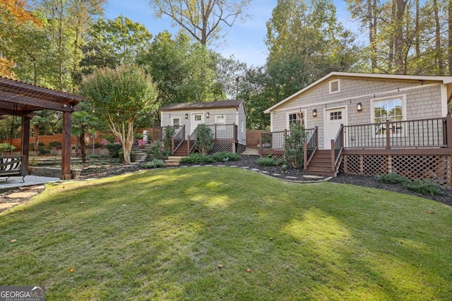 view of yard featuring a pergola and a deck