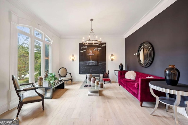 living room with light hardwood / wood-style flooring, crown molding, and a notable chandelier