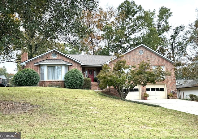 view of front of home featuring a garage and a front yard