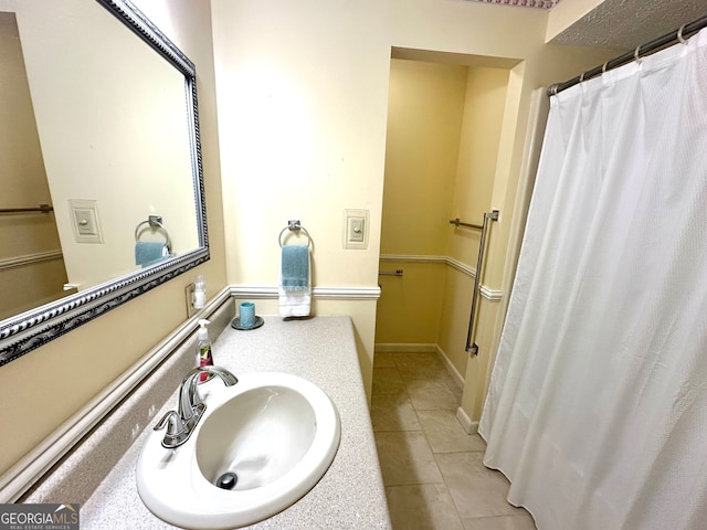 bathroom with sink and tile patterned floors