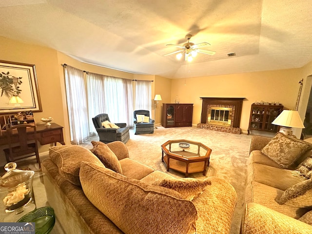 carpeted living room with a brick fireplace, ceiling fan, a textured ceiling, and vaulted ceiling