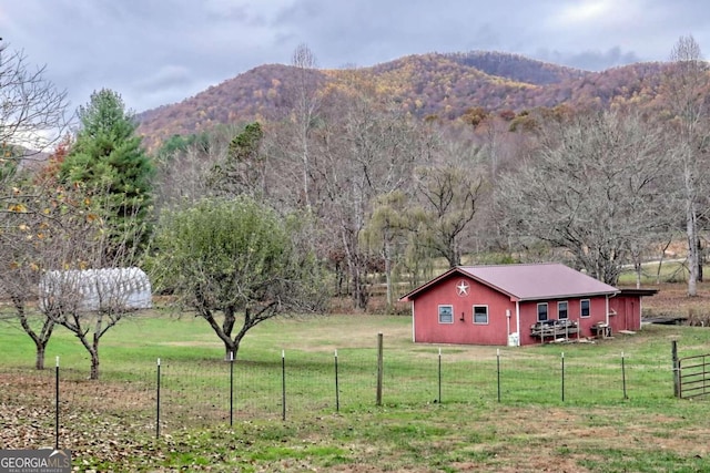 view of mountain feature with a rural view