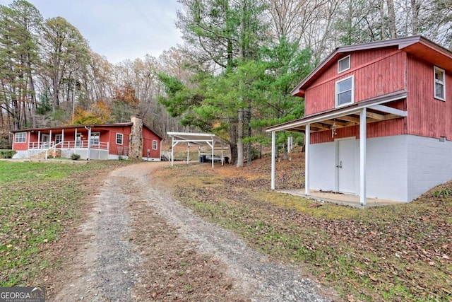 exterior space with a carport