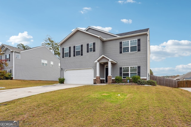 view of front of house with a garage and a front lawn