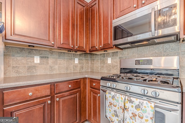 kitchen with backsplash and stainless steel appliances