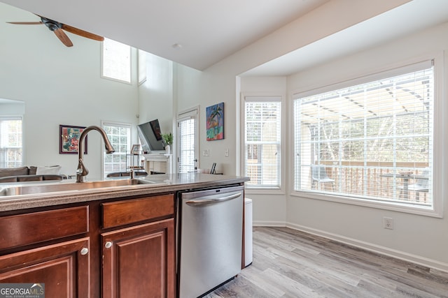 kitchen featuring dishwasher, light hardwood / wood-style flooring, sink, and ceiling fan