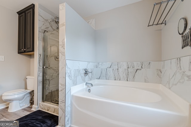 bathroom featuring hardwood / wood-style flooring, toilet, and plus walk in shower