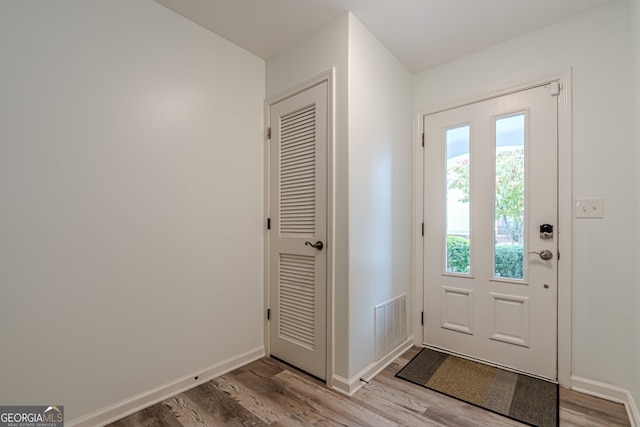 doorway with light hardwood / wood-style flooring