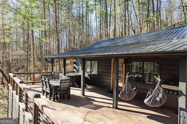 wooden terrace with area for grilling