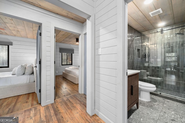 ensuite bathroom featuring ensuite bathroom, wooden ceiling, visible vents, a shower stall, and hardwood / wood-style floors