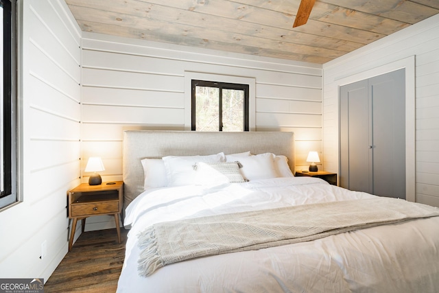 bedroom featuring wood ceiling and wood finished floors