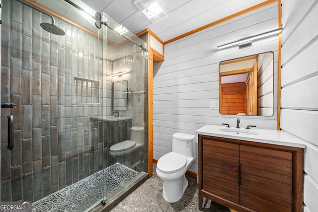 full bathroom with a shower stall, toilet, and vanity