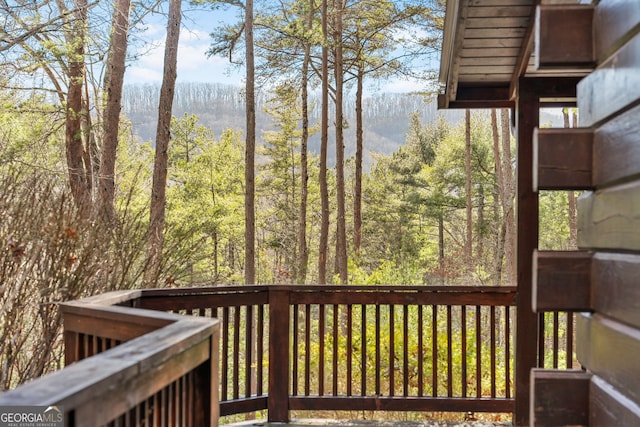 deck featuring a view of trees