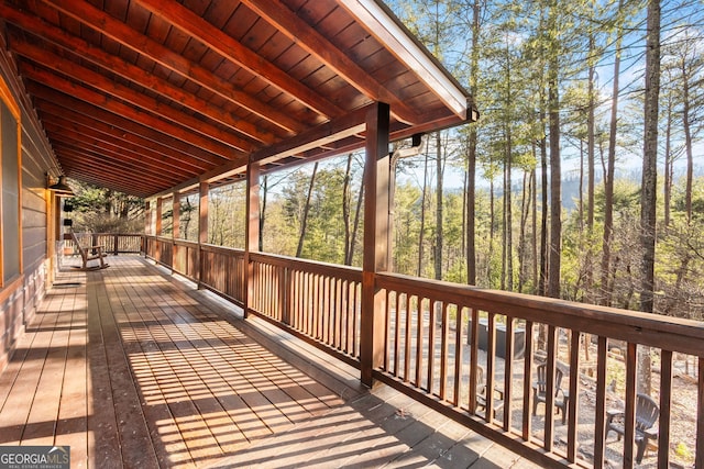 wooden terrace with a forest view