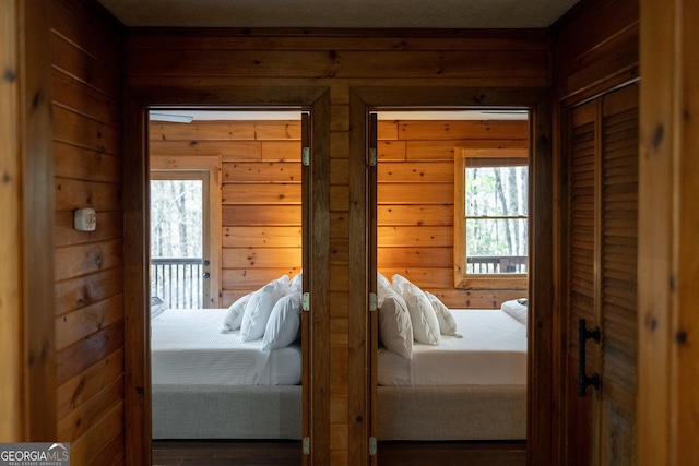 bedroom with wooden walls