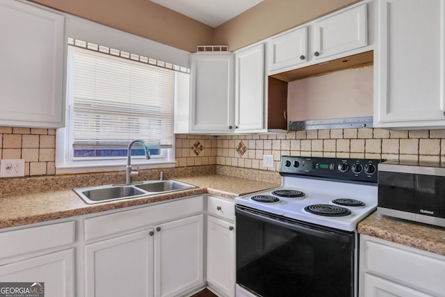 kitchen featuring white cabinetry, decorative backsplash, sink, and electric range