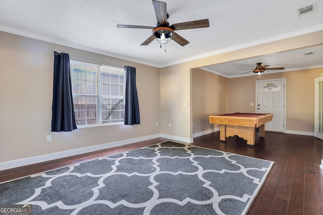 rec room with ornamental molding, pool table, dark wood-type flooring, and ceiling fan