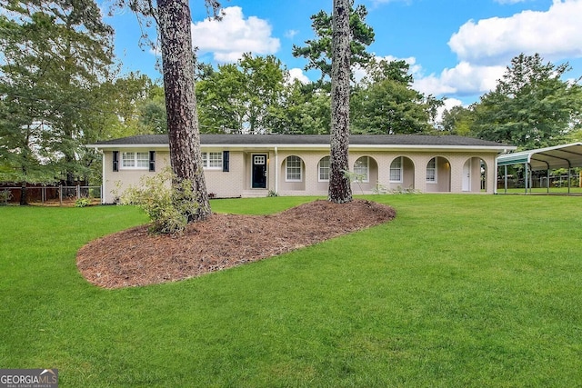 ranch-style home with a carport and a front yard