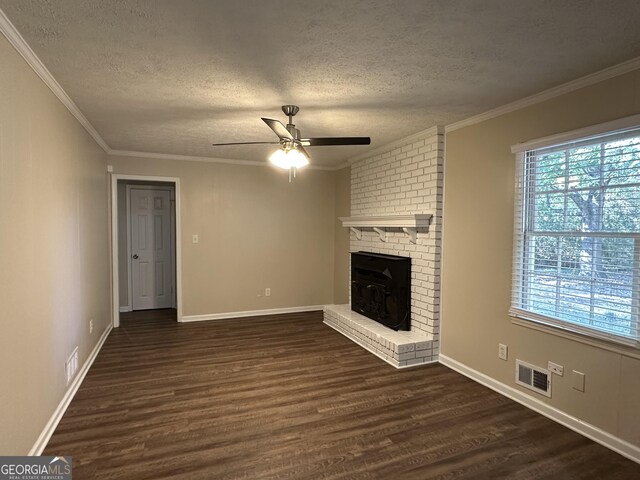 3617 Collins Dr, Douglasville, GA 30135 - unfurnished living room featuring a textured ceiling, healthy amount of natural light, dark wood-style floors, ceiling fan, and ornamental molding