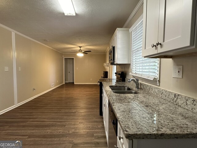 3617 Collins Dr, Douglasville, GA 30135 - kitchen with a sink, a textured ceiling, ceiling fan, white cabinetry, and range