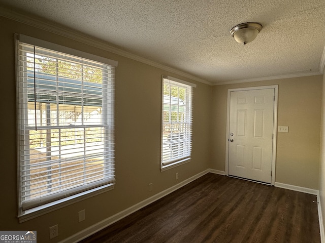 3617 Collins Dr, Douglasville, GA 30135 - foyer entrance with a textured ceiling, dark wood finished floors, baseboards, and ornamental molding