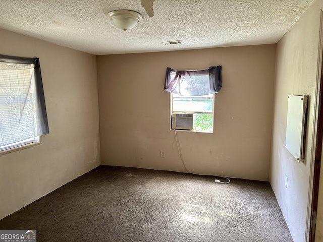 2155 Ferguson St, Macon, GA 31204 - carpeted spare room featuring cooling unit and a textured ceiling